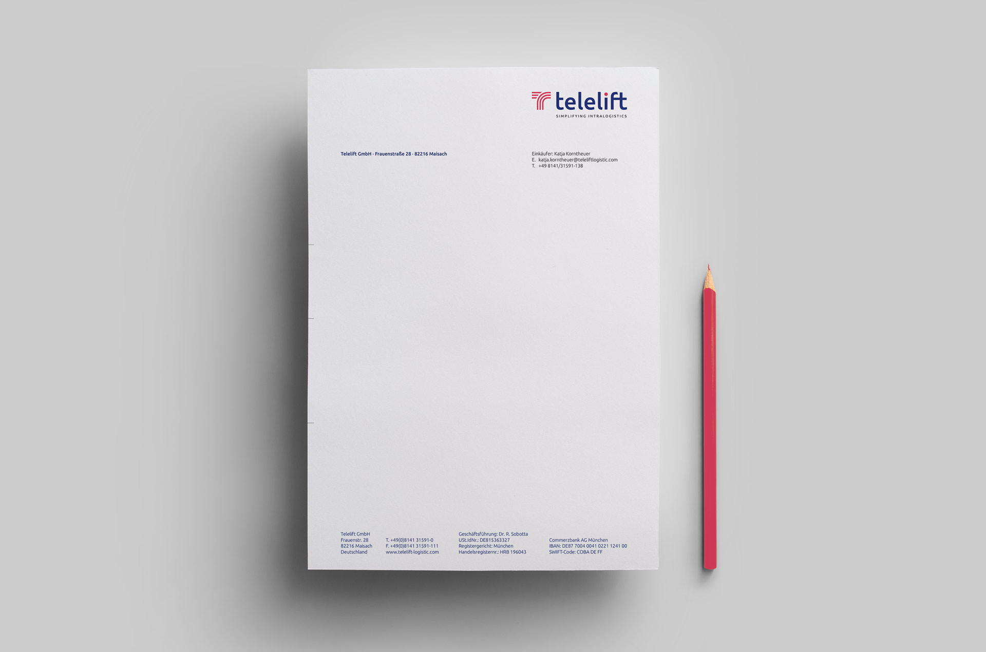 Telelift – Briefpapier mit einem roten Buntstift daneben.